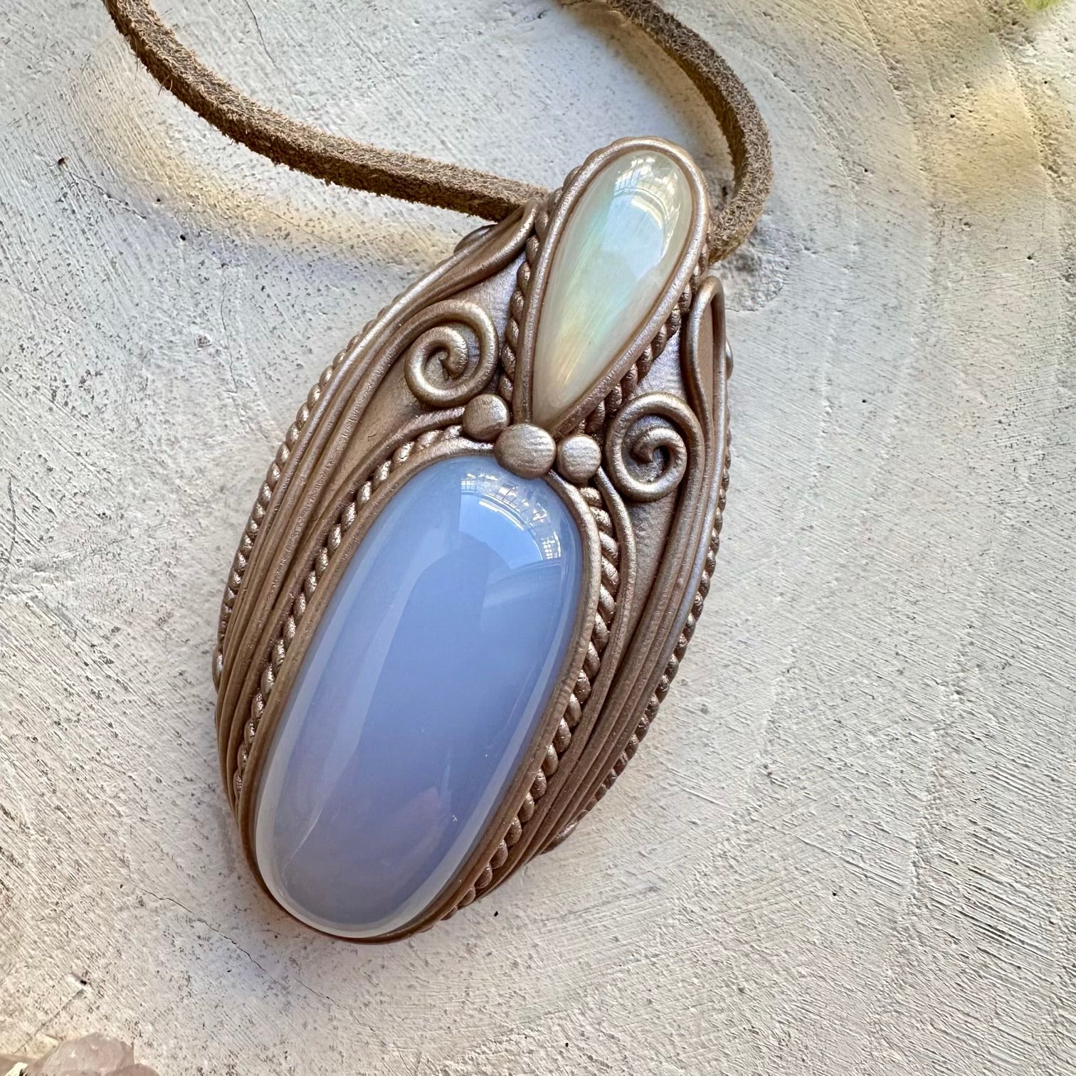 Blue chalcedony paired with rainbow moonstone in a necklace