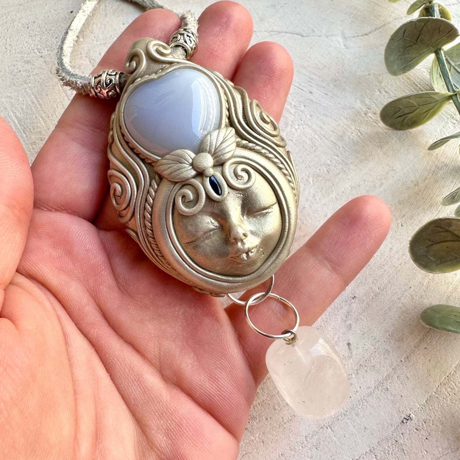 One of a kind crystal Goddess pendant with a blue Chalcedony Heart and natural Blue Sapphire.