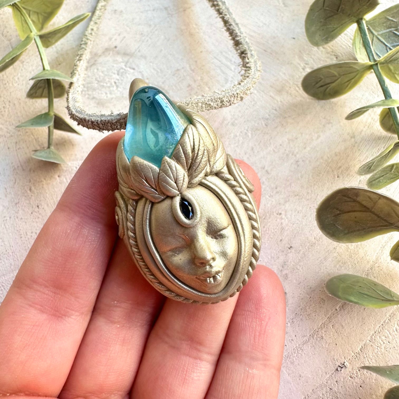 One of a kind crystal Goddess pendant with luminous Aqua Aura Quartz and deep blue Sapphire.