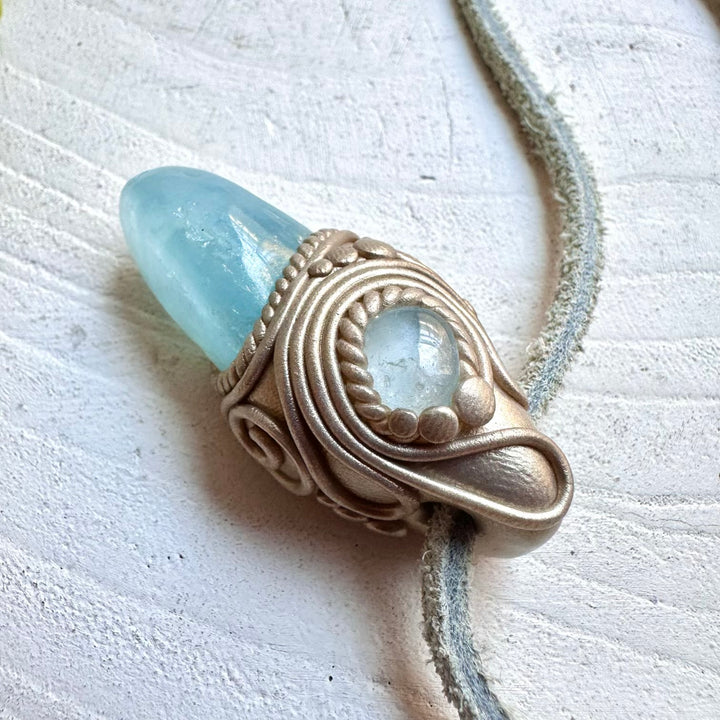 Protection amulet crystal necklace with aquamarine and blue topaz gemstones