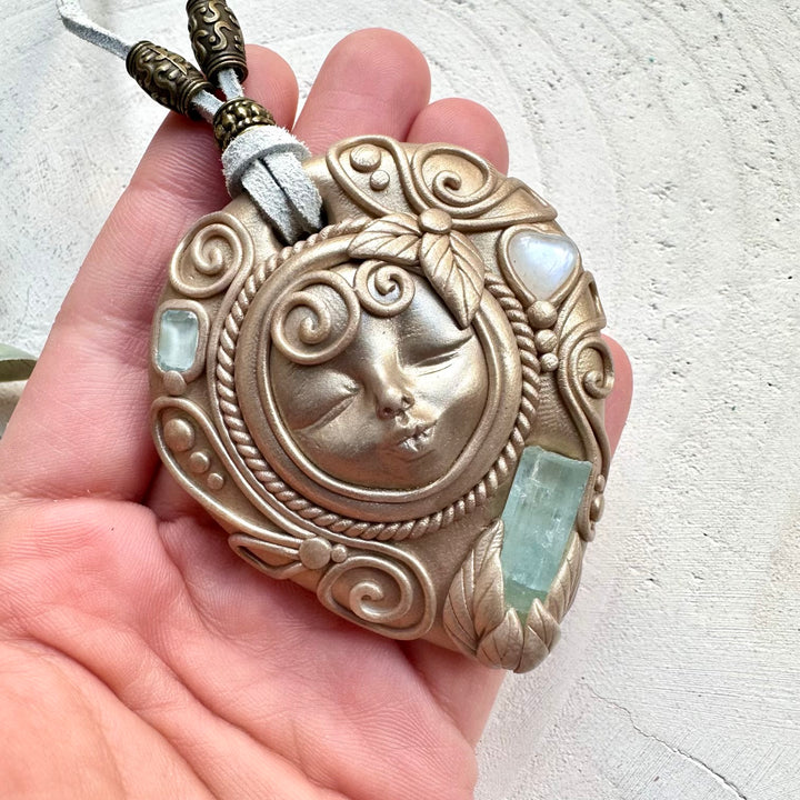 Healing crystal goddess pendant with blue topaz and moonstone