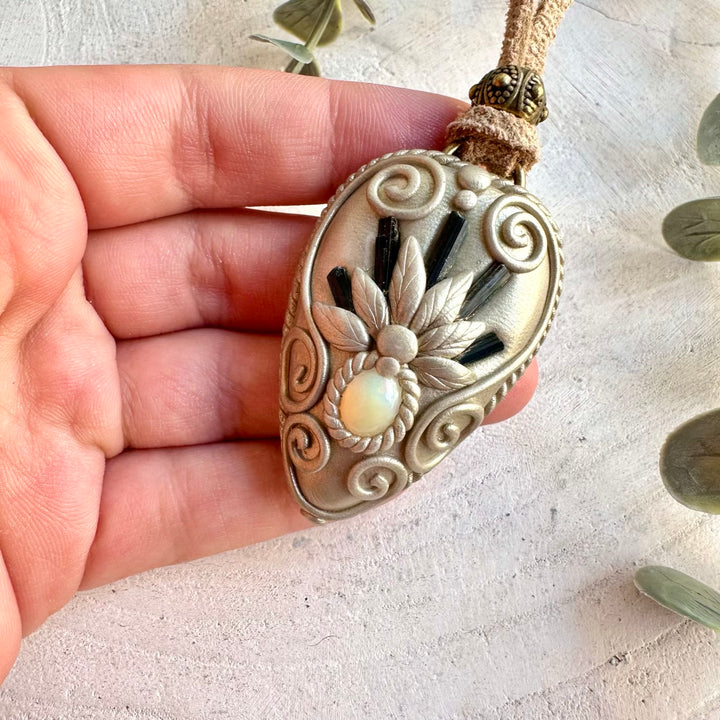 Handmade healing crystal jewelry featuring Blue Tourmaline and natural Ethiopian Opal.