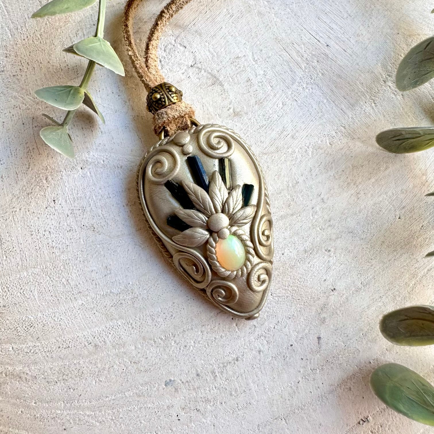 Handmade Blue Tourmaline and Ethiopian Opal pendant necklace, a one of a kind gemstone jewelry piece combining rich blue Tourmaline with the mesmerizing natural flashes of Ethiopian Opal. An elegant spiritual necklace inspired by calm, clarity, creativity, intuition and personal transformation.