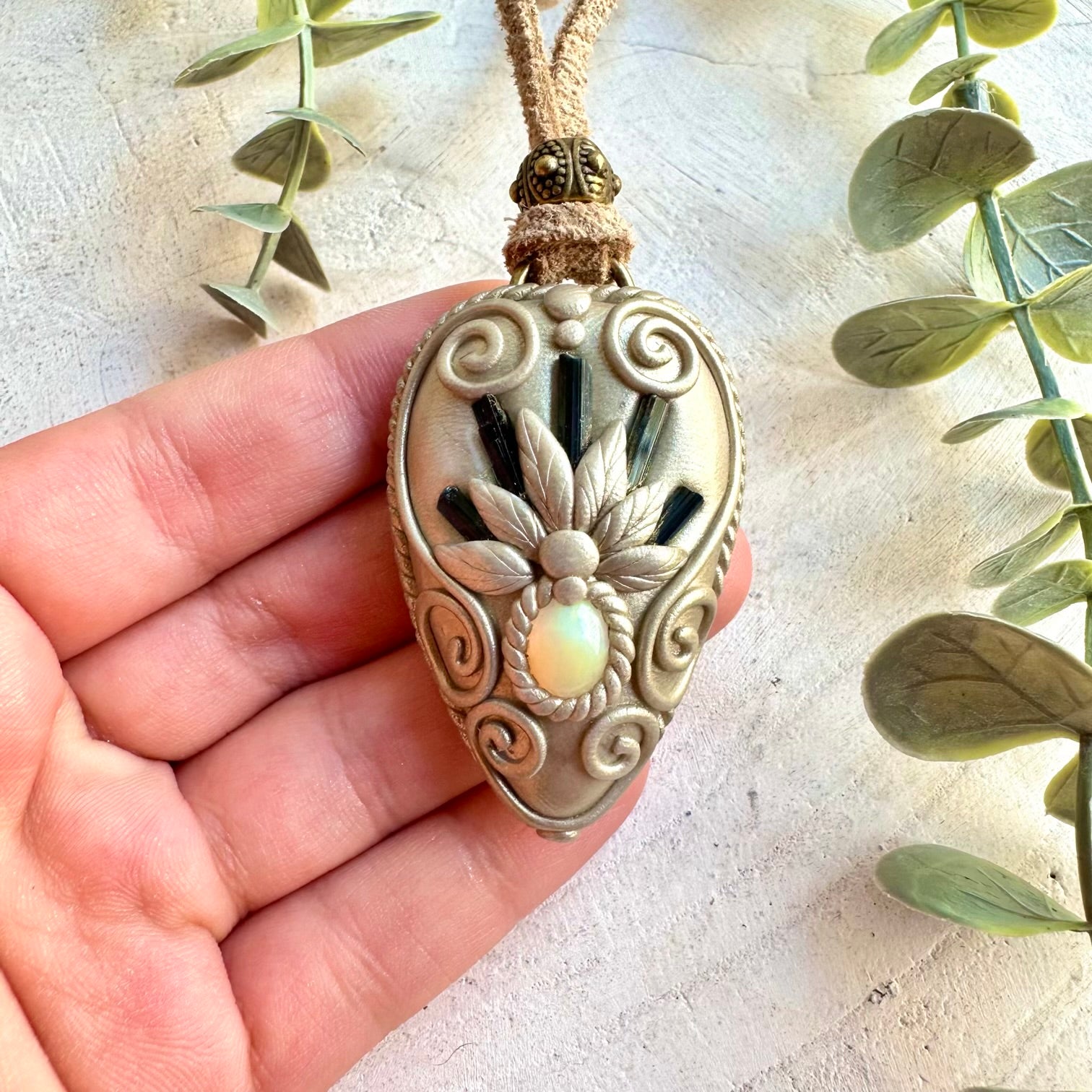 Spiritual gemstone necklace handcrafted with Blue Tourmaline and Ethiopian Opal.