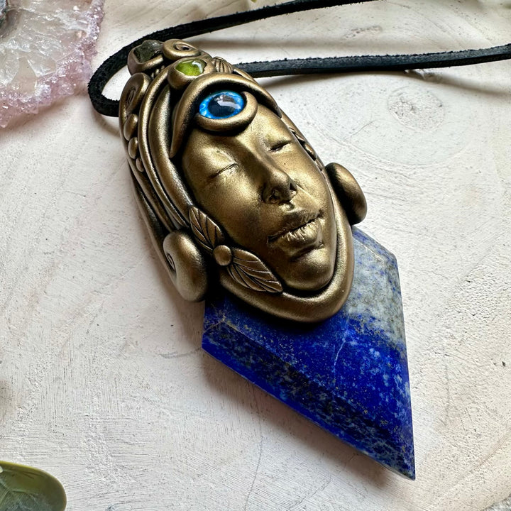 Metaphysical crystal jewelry with moldavite and lapis lazuli