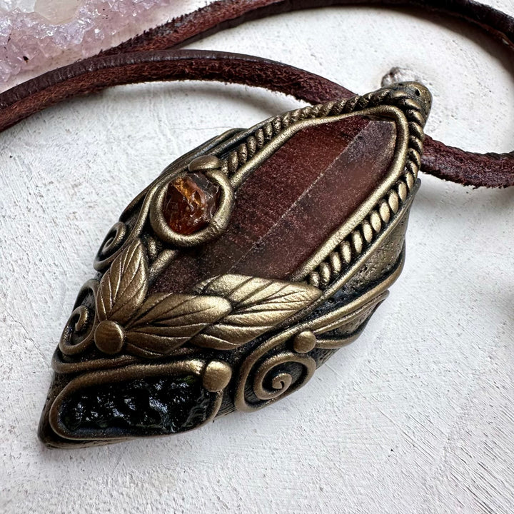 Energy pendant with red quartz hessonite garnet and moldavite