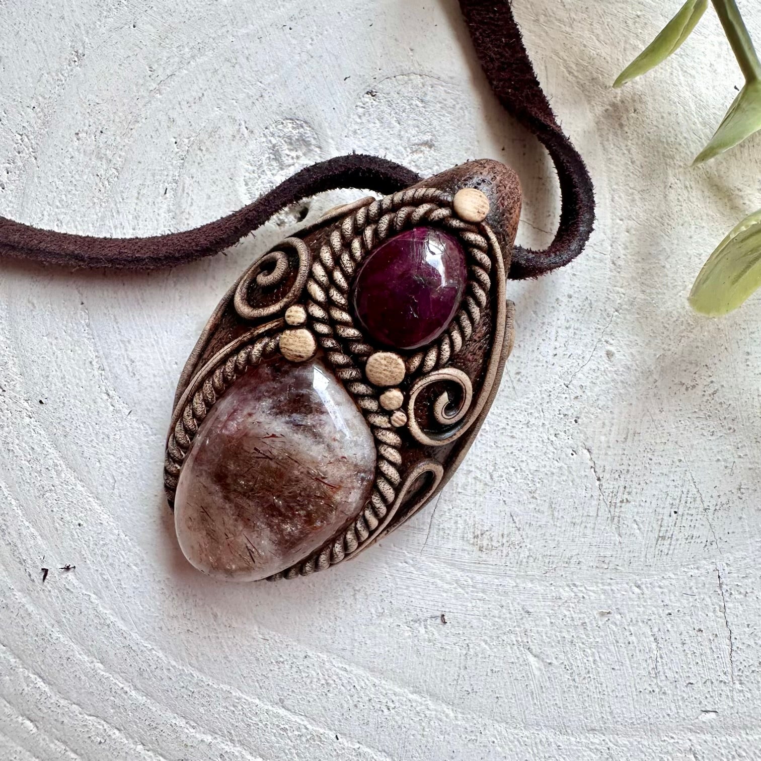Spiritual crystal necklace featuring Hematite Quartz and Ruby for courage, protection and emotional balance