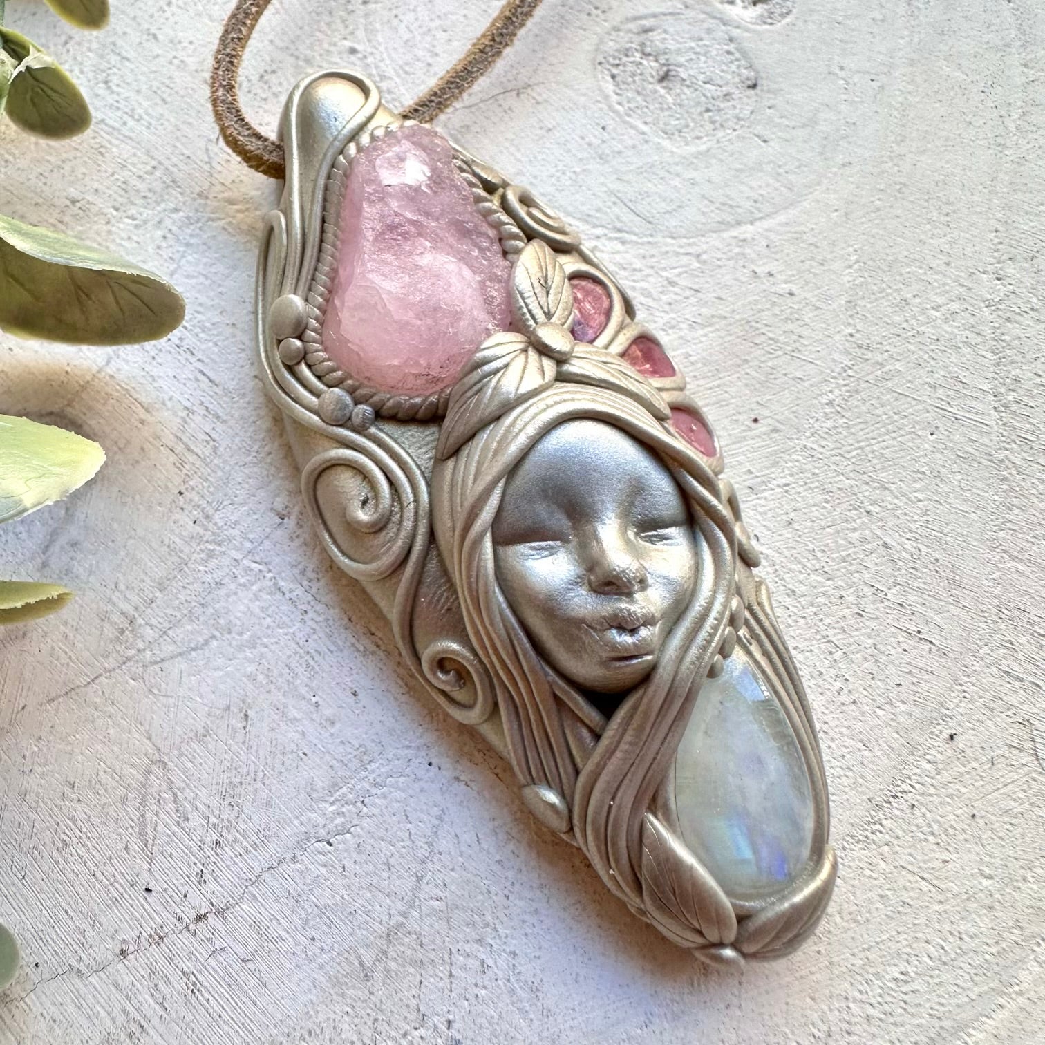 Morganite paired with pink tourmaline and moonstone in a necklace
