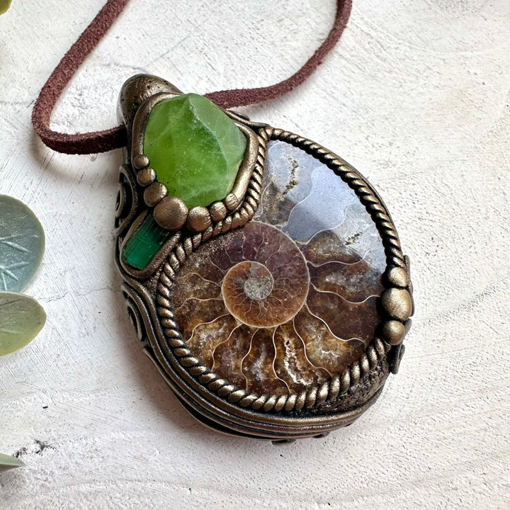 Boho spiritual crystal necklace with ammonite fossil and green tourmaline gemstone details