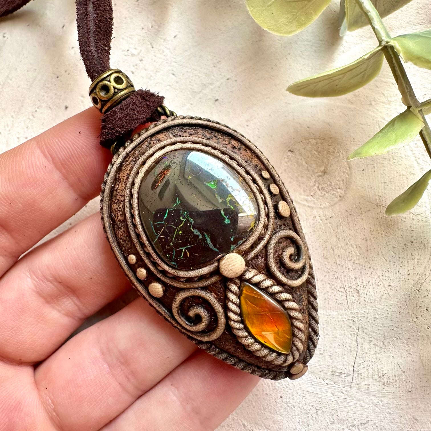 Handmade Boulder Opal and Ammolite pendant necklace with genuine natural gemstones.