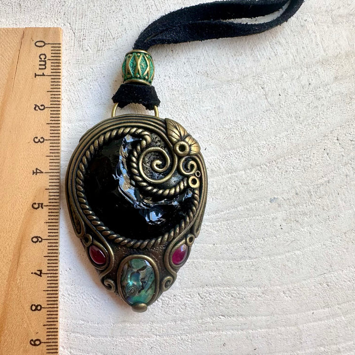 Handmade Black Obsidian Moon pendant necklace featuring Abalone Seashell and Rhodolite Garnet, a one of a kind spiritual crystal talisman designed for protection, grounding, emotional balance and inner strength.