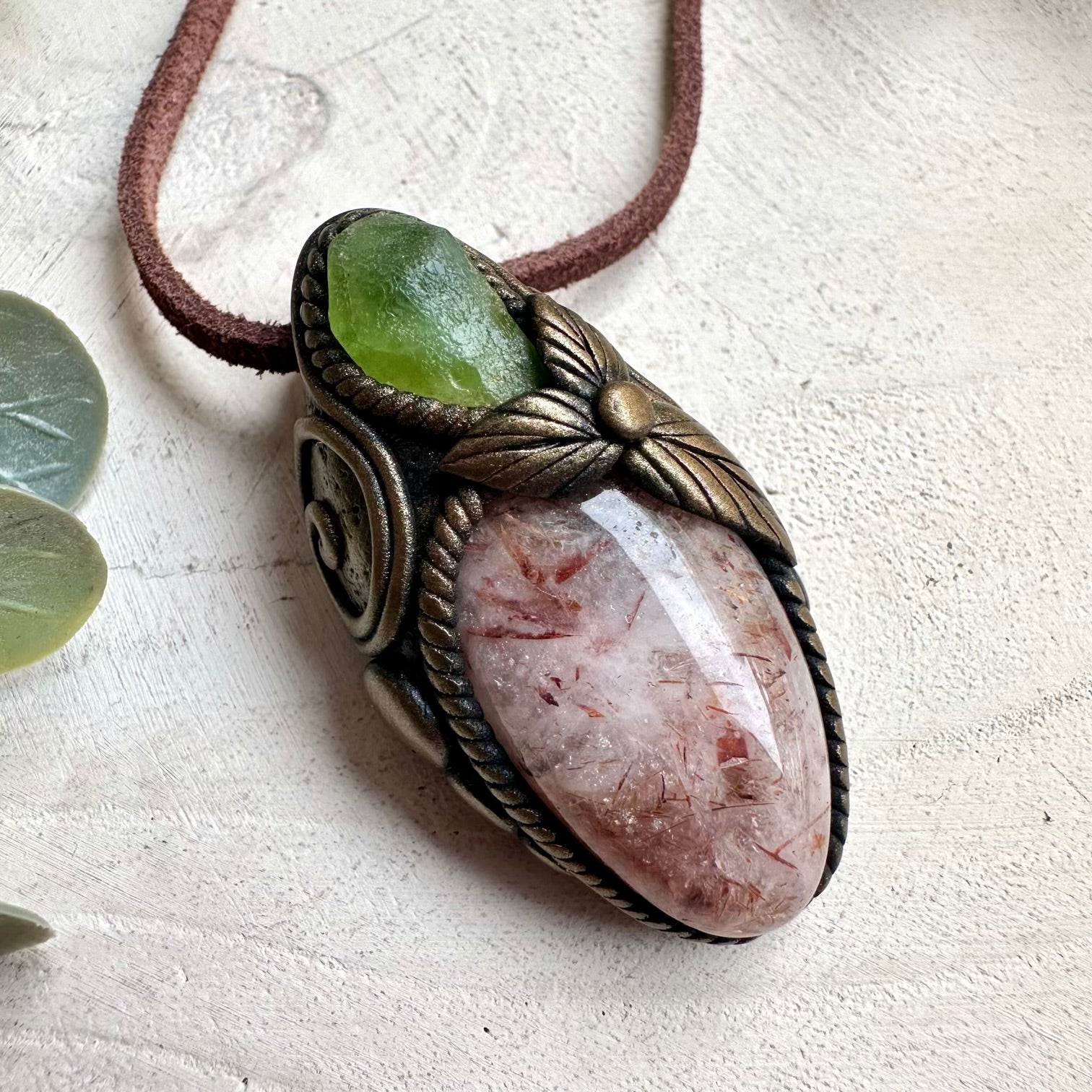 Witchy crystal necklace with Hematite Quartz and Peridot talisman pendant for mystical rituals and energy work.