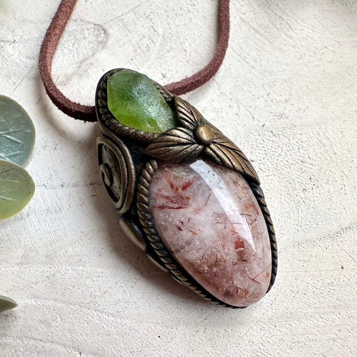 Witchy crystal necklace with Hematite Quartz and Peridot talisman pendant for mystical rituals and energy work.