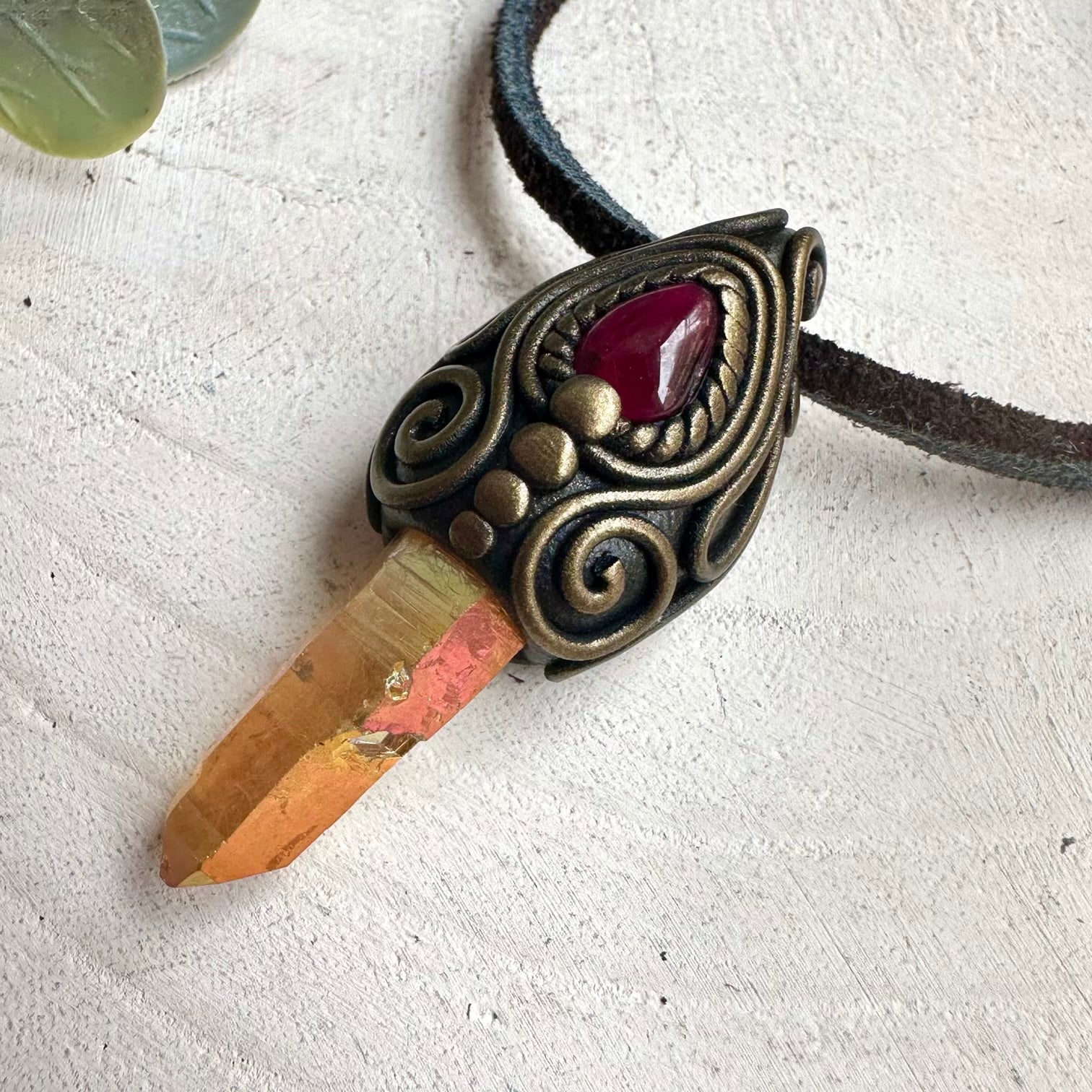 Fantasy-inspired healing crystal necklace with shimmering Sunset Aura Quartz and deep red Garnet gemstones.