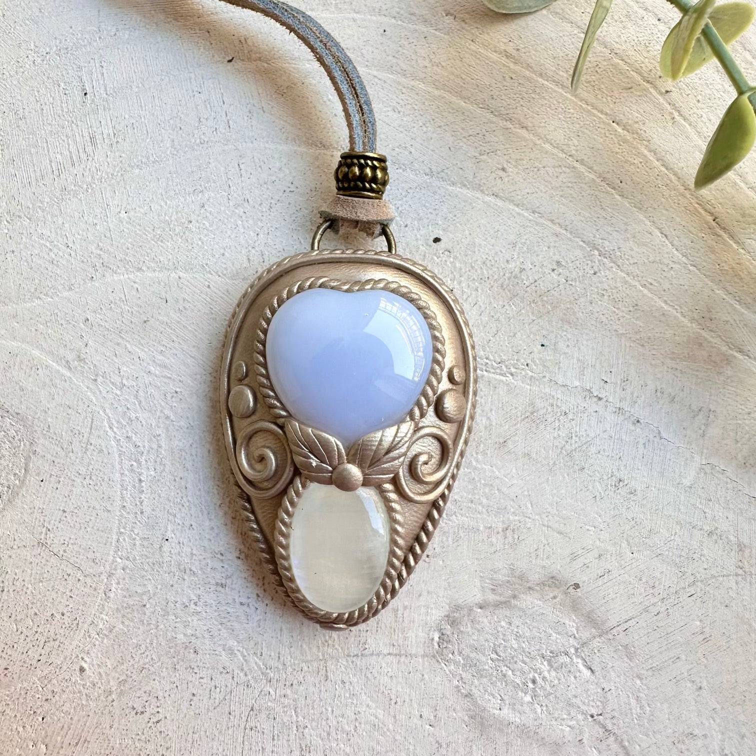 Crystal talisman necklace with chalcedony heart and moonstone healing stones