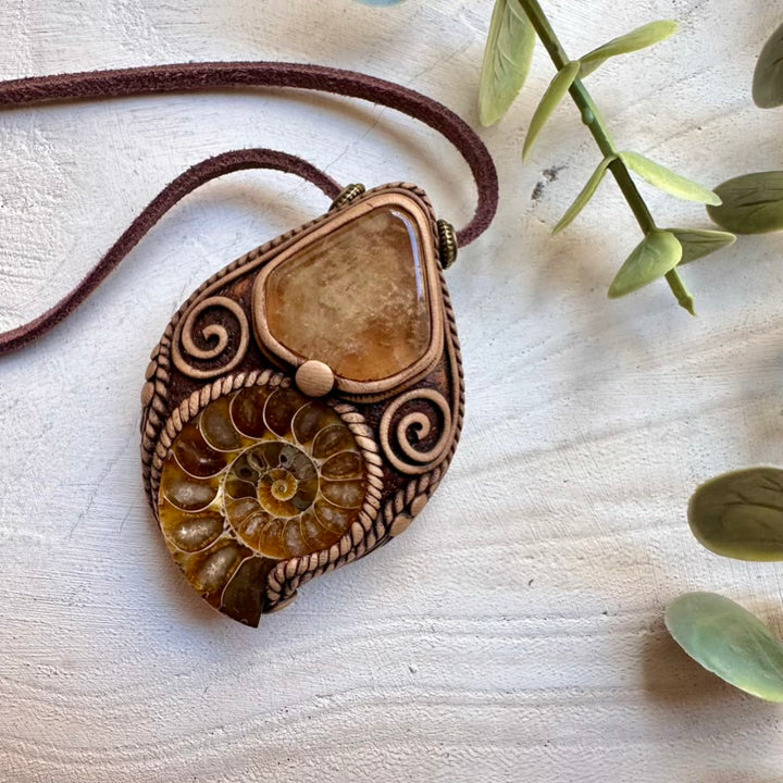 Handmade necklace featuring citrine and natural ammonite fossil