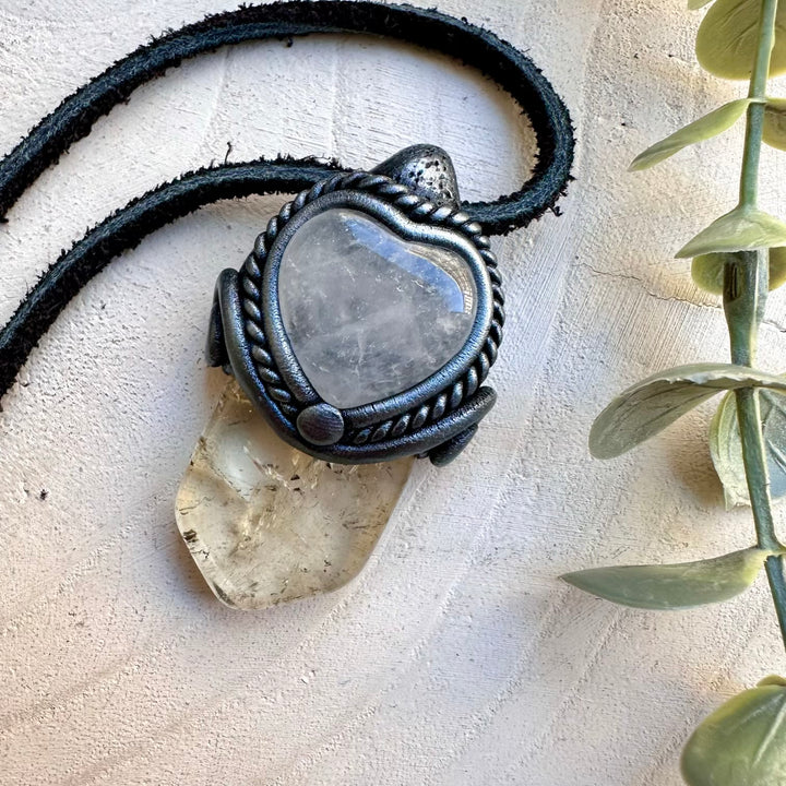 Natural citrine paired with a clear quartz heart in a pendant