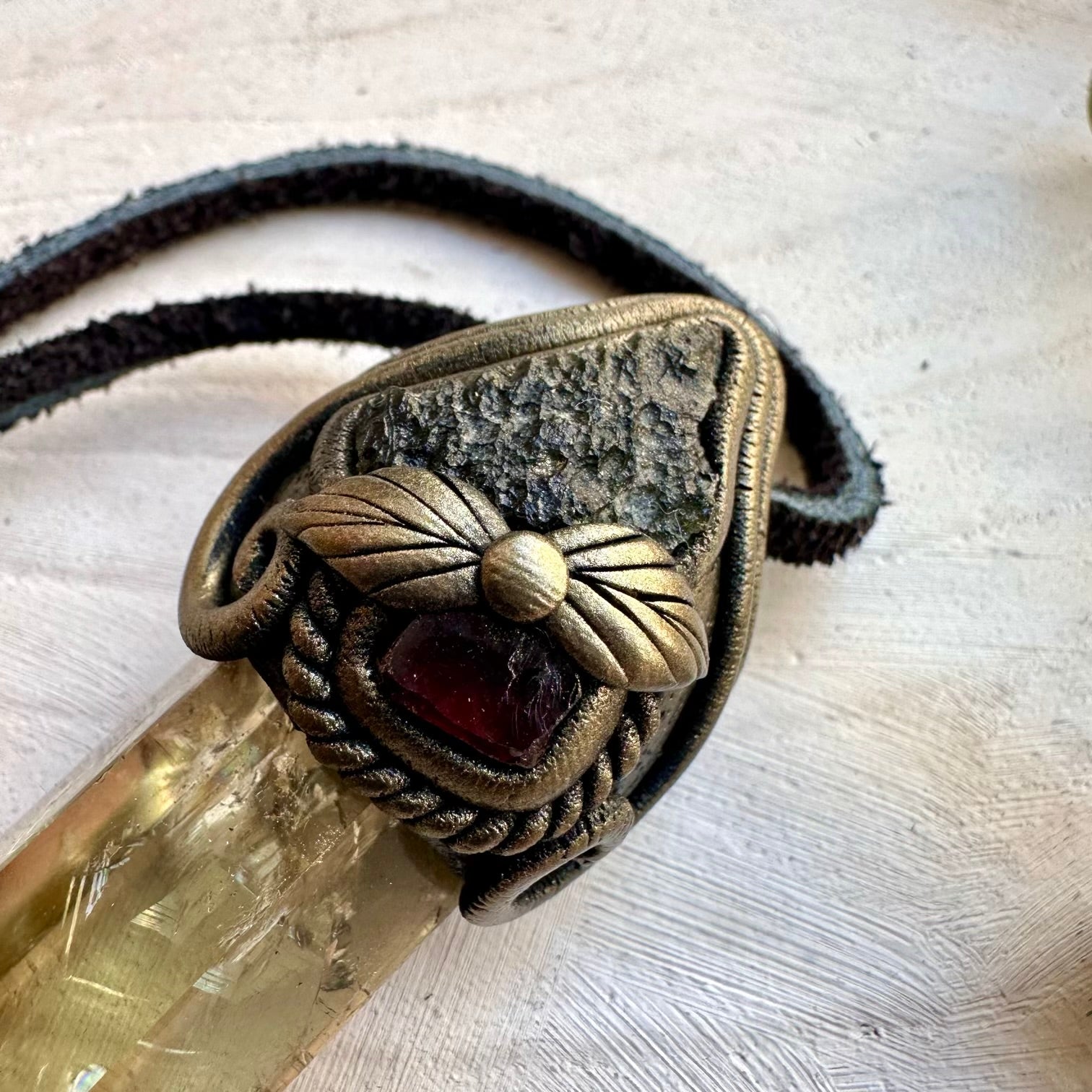 Energy pendant combining citrine for abundance and moldavite for transformation