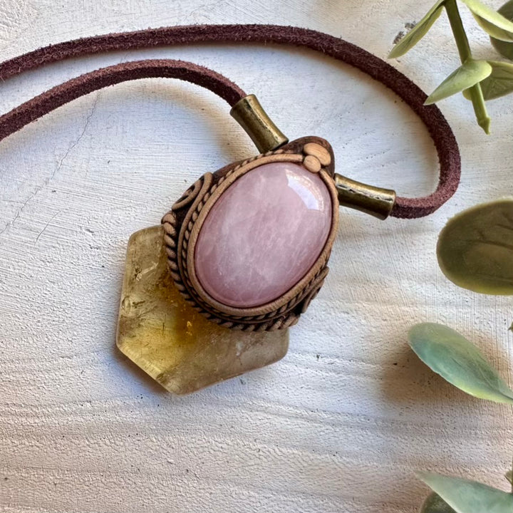 Natural polished citrine paired with rose quartz in a pendant
