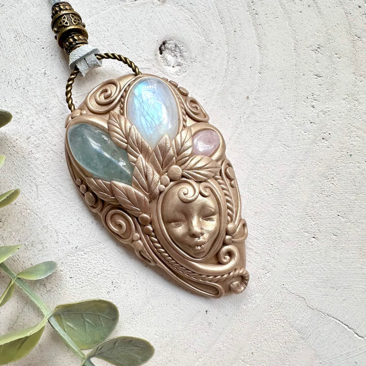 Rainbow moonstone paired with celestite and morganite in a necklace