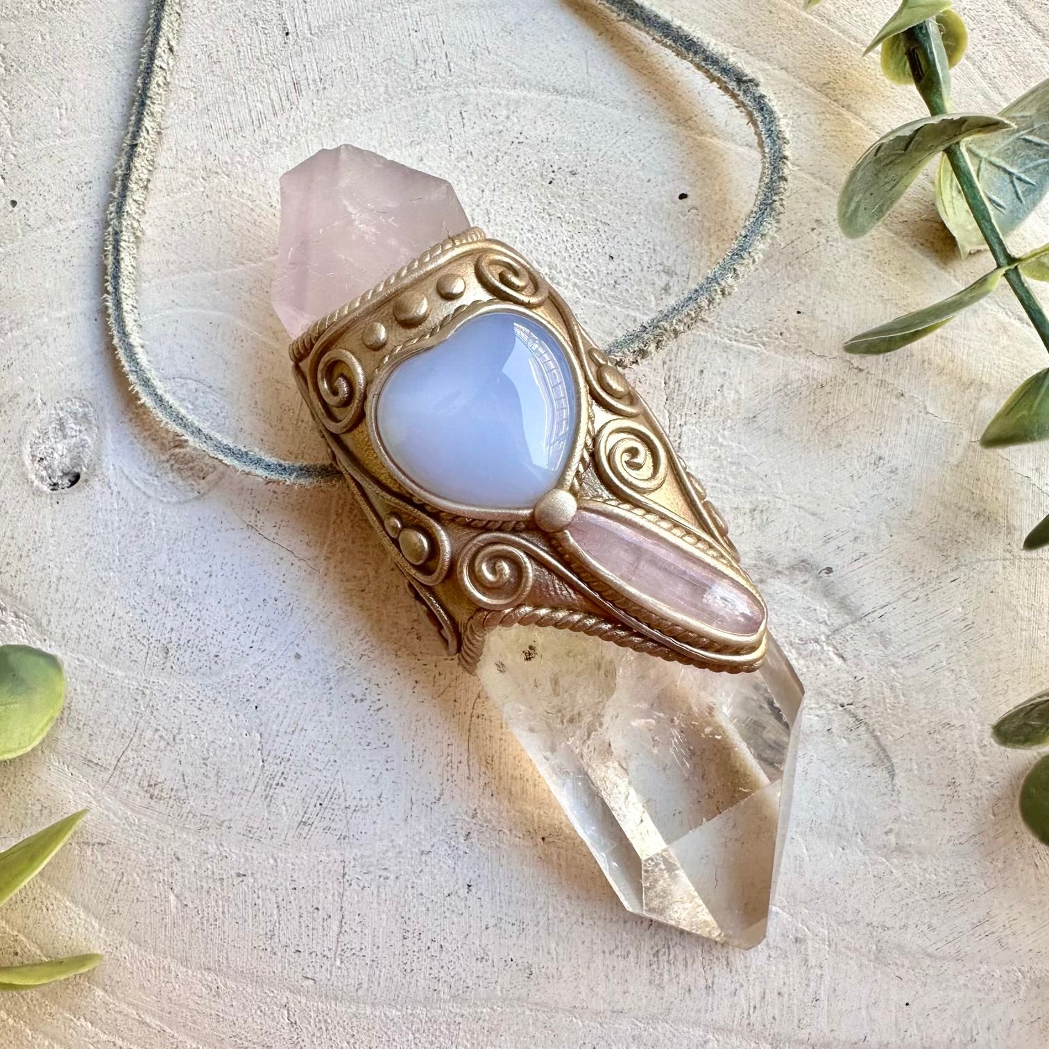 Handmade healing crystal wand with clear quartz and natural gemstones for spiritual practice