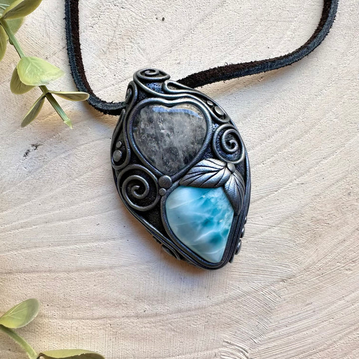 Healing crystal pendant with larimar and quartz heart