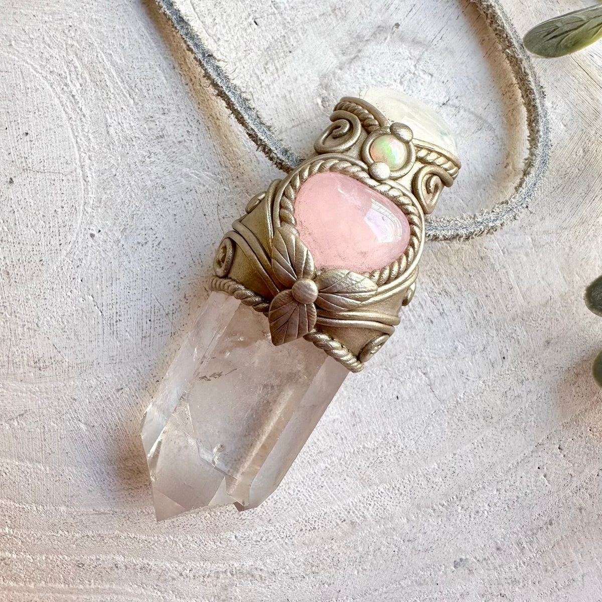 Artisan crystal pendant combining Clear Quartz with a Rose Quartz Heart, Moonstone and Ethiopian Opal accents.