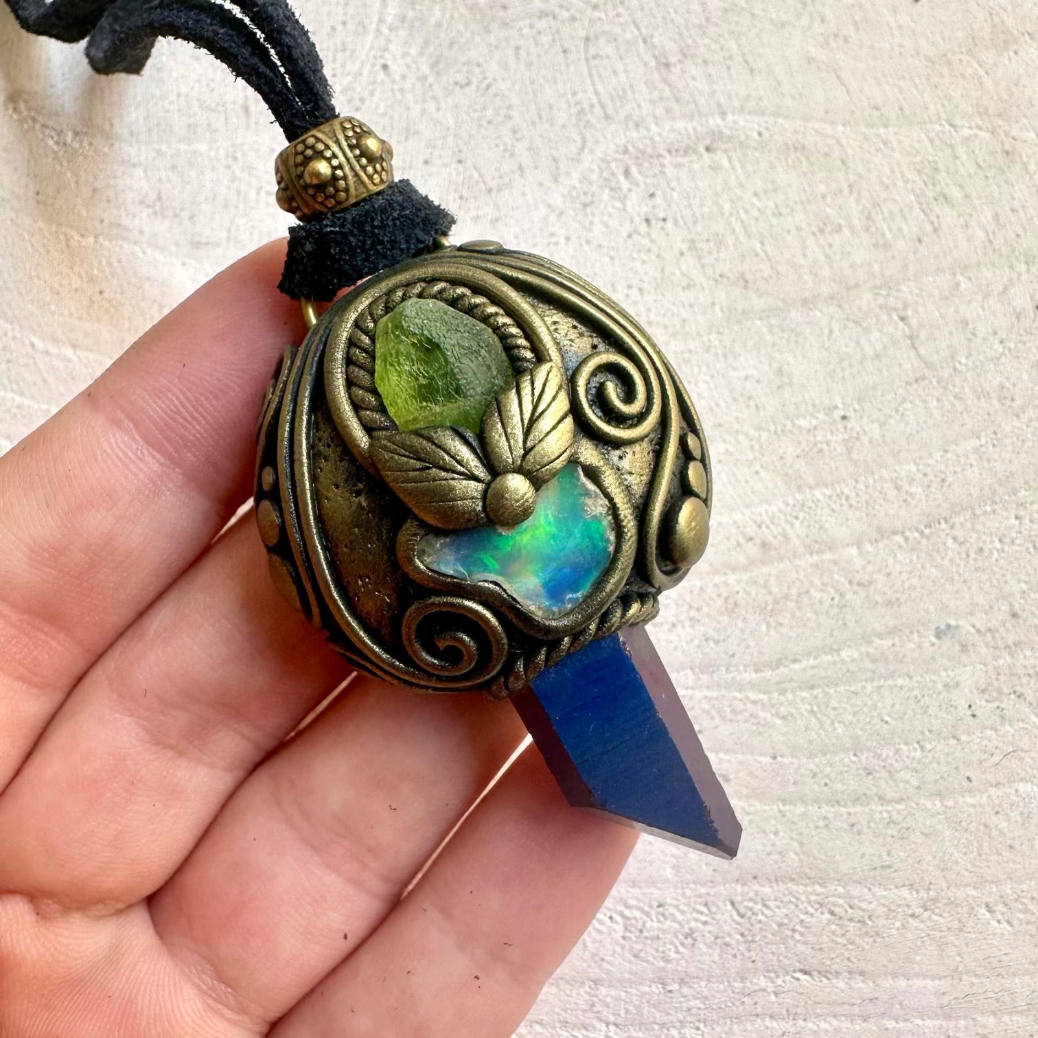 Handmade unisex pendant necklace featuring Cobalt Aura Quartz, Peridot and Raw Ethiopian Opal natural gemstones.