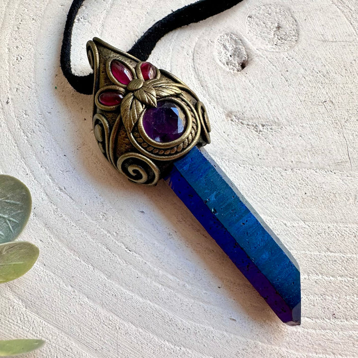 One of a kind crystal necklace featuring shimmering Cobalt Aura Quartz and colorful Rainbow Fluorite.