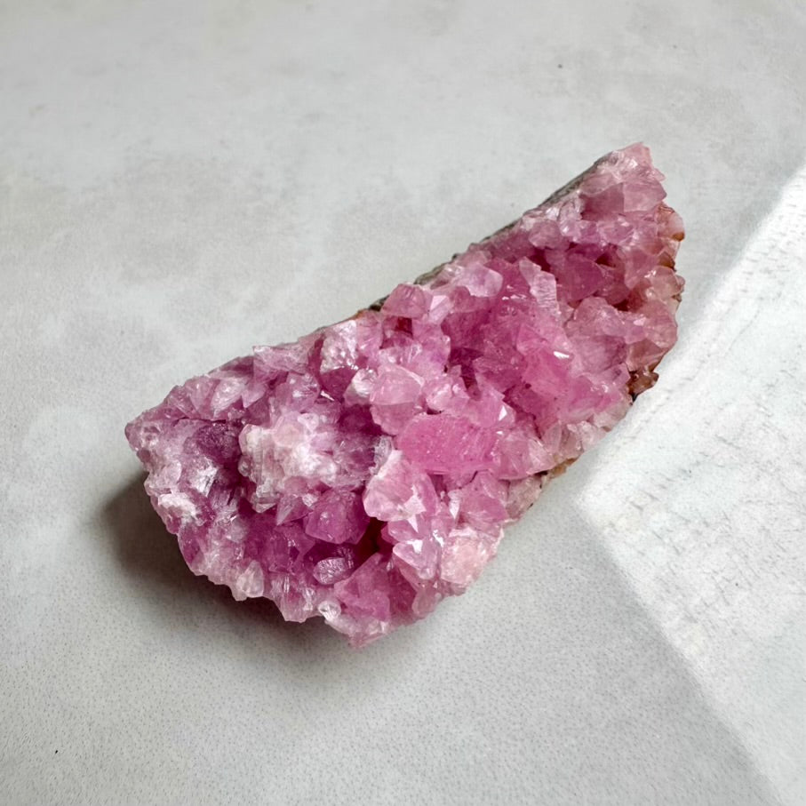 Natural Cobalto Calcite mineral cluster with vibrant pink crystals