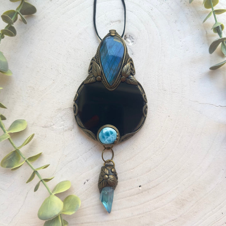 Crystal scrying mirror featuring Labradorite, Larimar and Aqua Aura Quartz