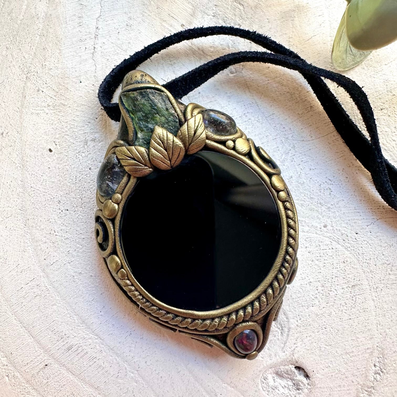 Mystical crystal pendant necklace featuring Black Obsidian, Moldavite and Ethiopian Opal.