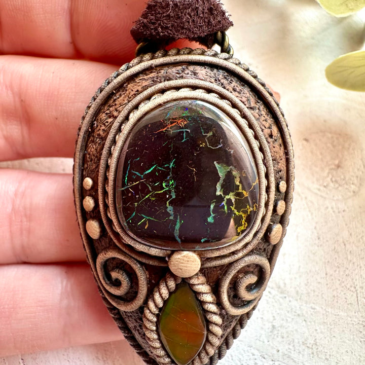 Crystal talisman necklace made with genuine Boulder Opal and Ammolite gemstones.