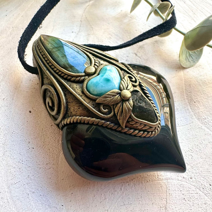 Crystal talisman necklace crafted with Rainbow Obsidian, Moldavite and a heart-shaped Larimar.