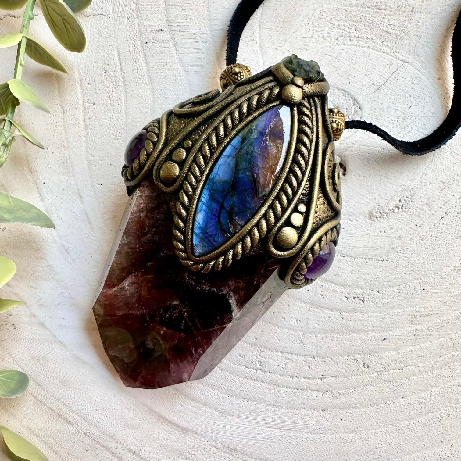 Unique Healing gemstone crystal wand featuring Super Seven Quartz and colorful natural crystals.