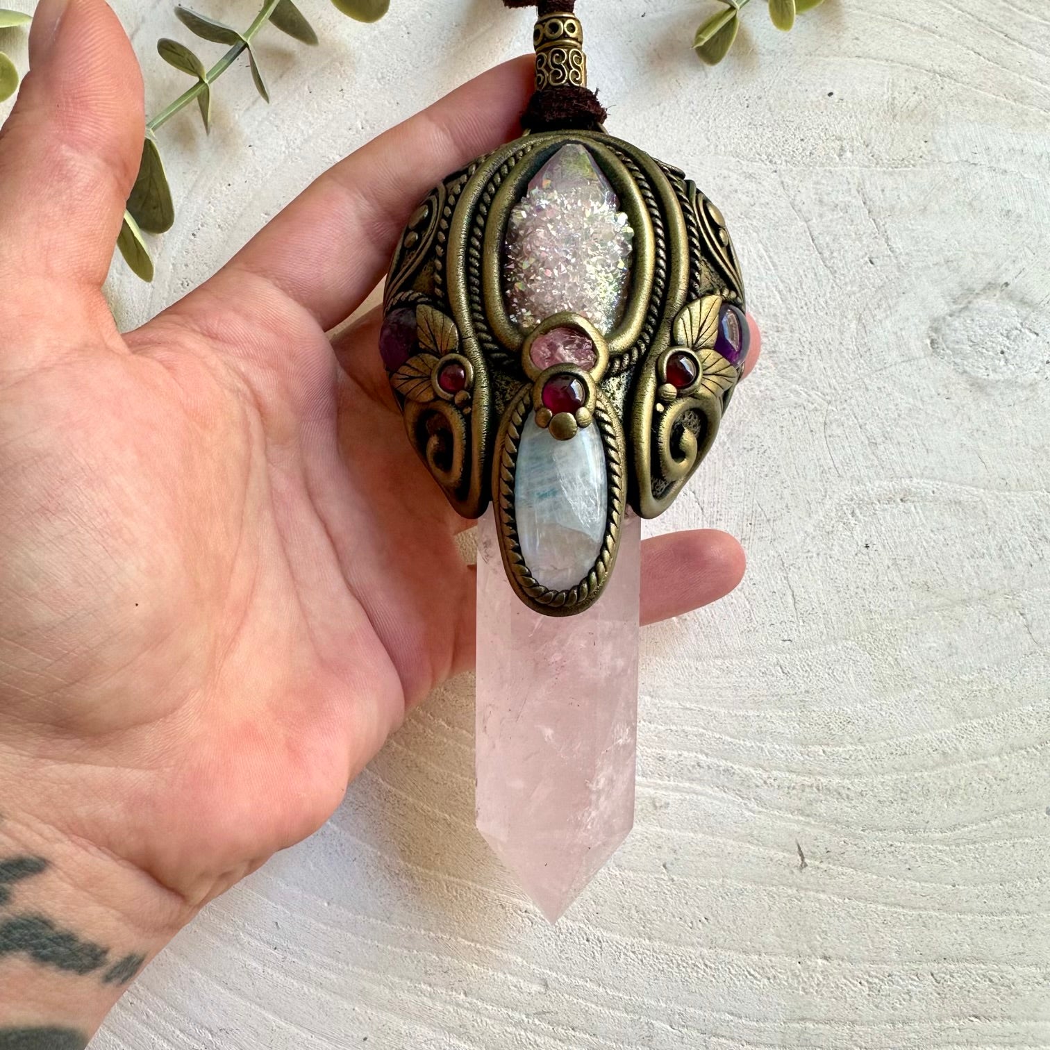 Handmade Rose Quartz healing crystal wand pendant necklace featuring Angel Aura Spirit Quartz, Moonstone, Amethyst, Gemmy Rhodochrosite and Rhodolite Garnet, a one of a kind energy and ritual tool designed for self-love, emotional healing, intuition, spiritual growth and heart-centered transformation.