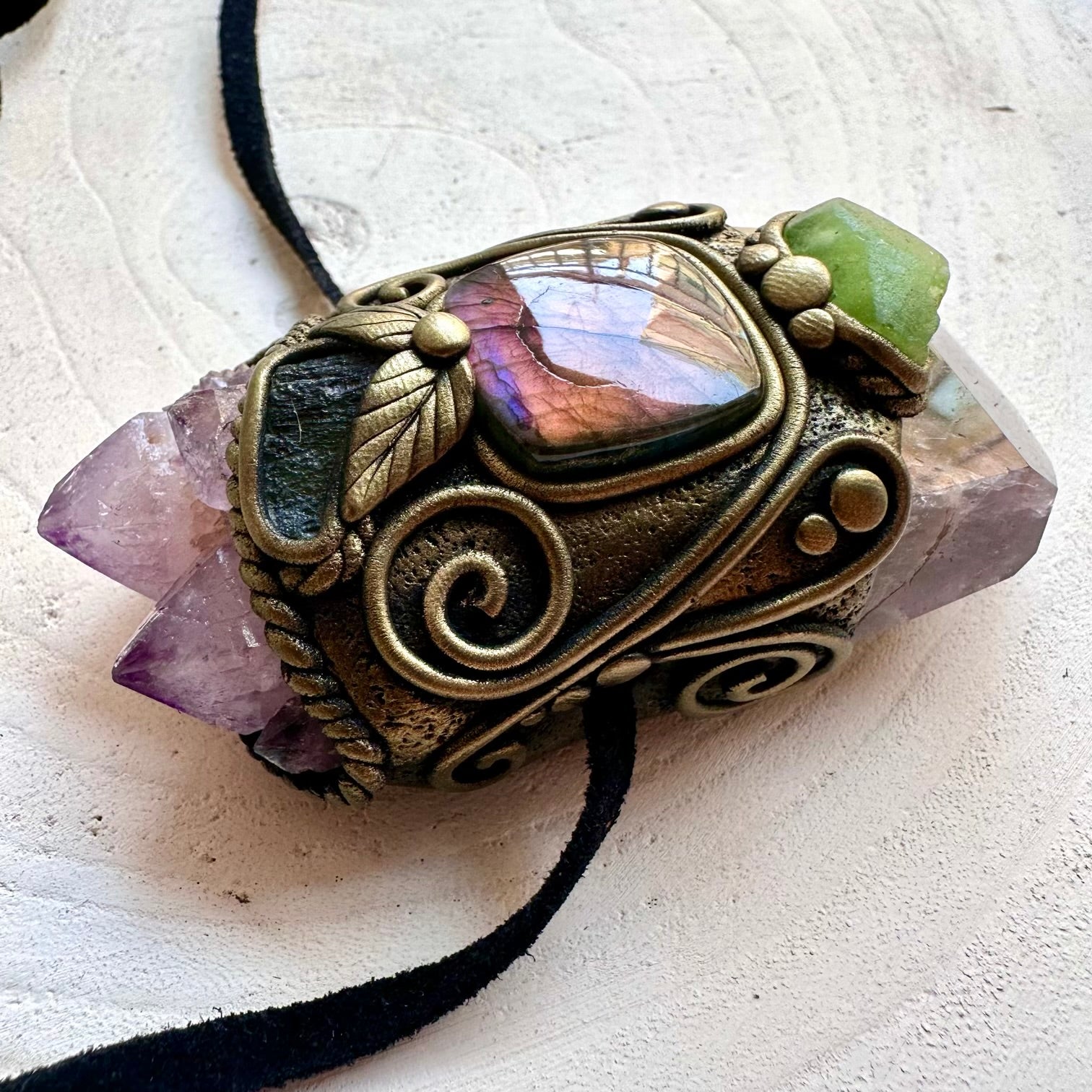Spiritual crystal pendant featuring Super Seven Quartz with Spirit Quartz Cluster and natural gemstone accents.