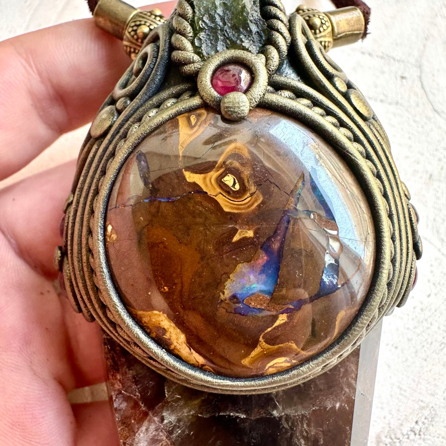 Crystal healing pendant necklace designed with Super Seven Quartz and colorful natural crystals.