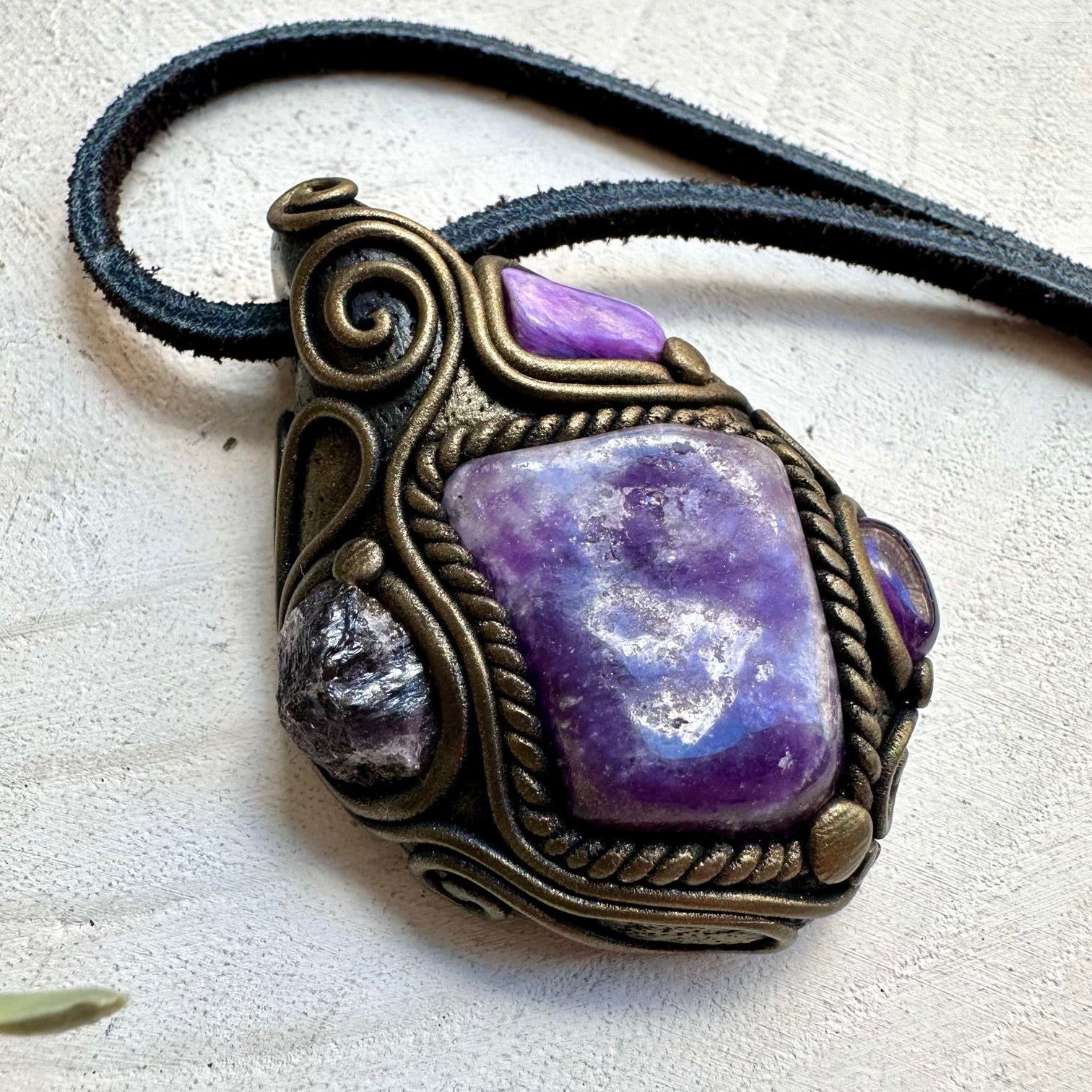 Lepidolite paired with charoite and scapolite in a pendant