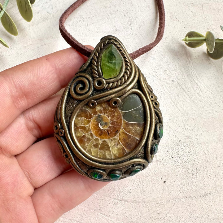Earthy bohemian healing jewelry necklace with ammonite fossil and natural opal crystal design