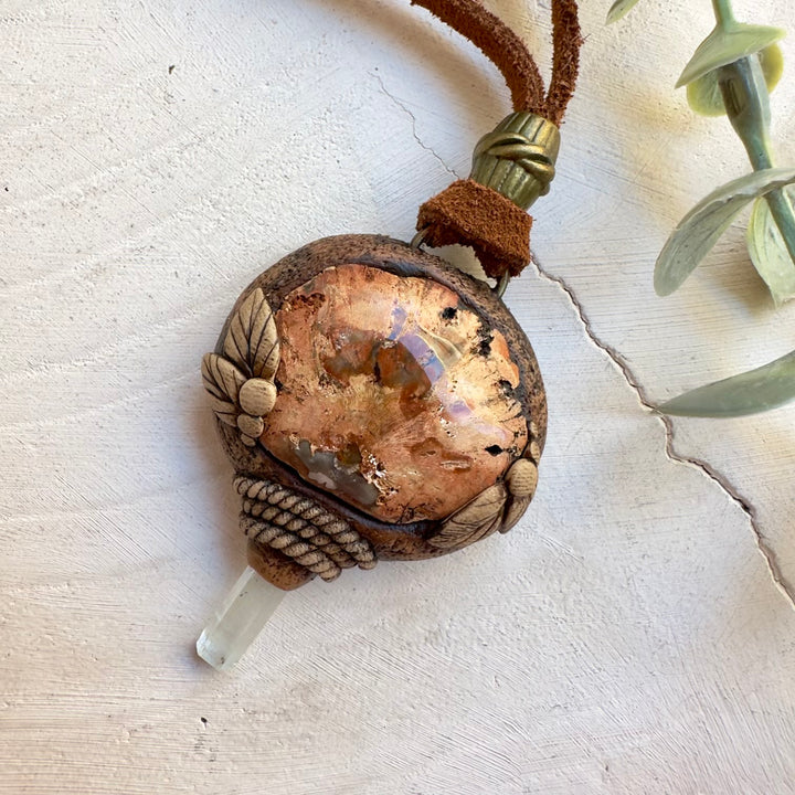 Handmade boho crystal jewelry with petrified wood pendant