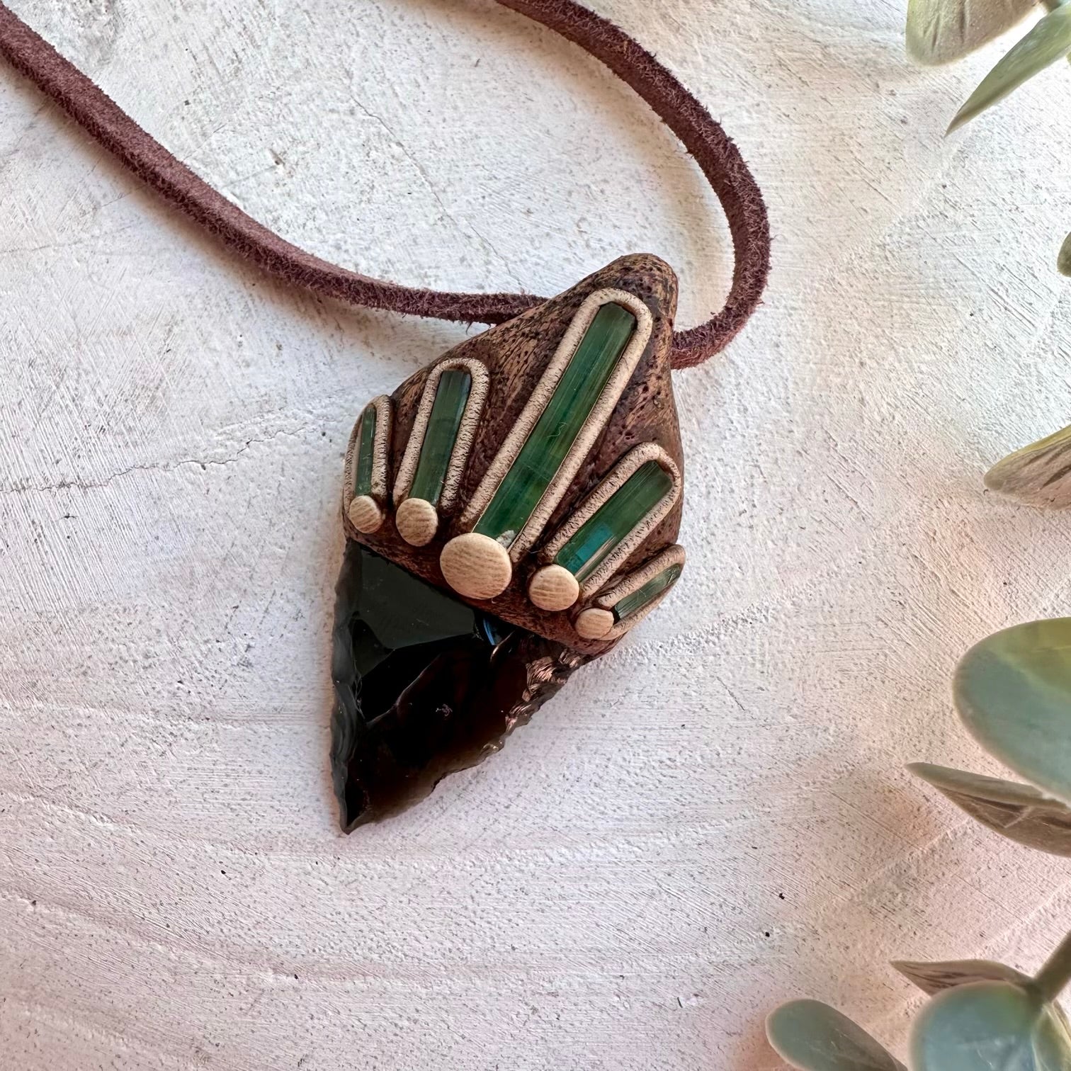 Metaphysical jewelry featuring protective and heart-centered crystals