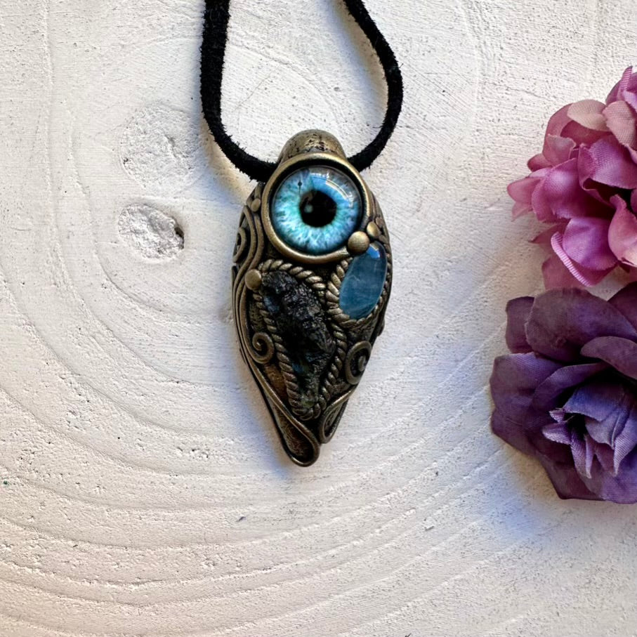 Festival-ready healing crystal eye pendant with ethically sourced Moldavite and Aquamarine, handmade talisman jewelry.