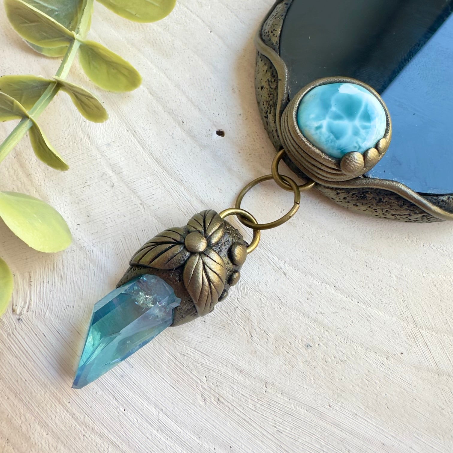 Black Obsidian mirror surrounded by Larimar and Labradorite gemstones
