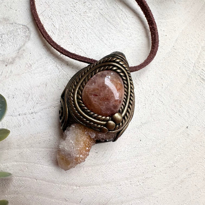 Protection amulet necklace featuring healing crystals Spirit Quartz and Hematite Quartz for positive energy.