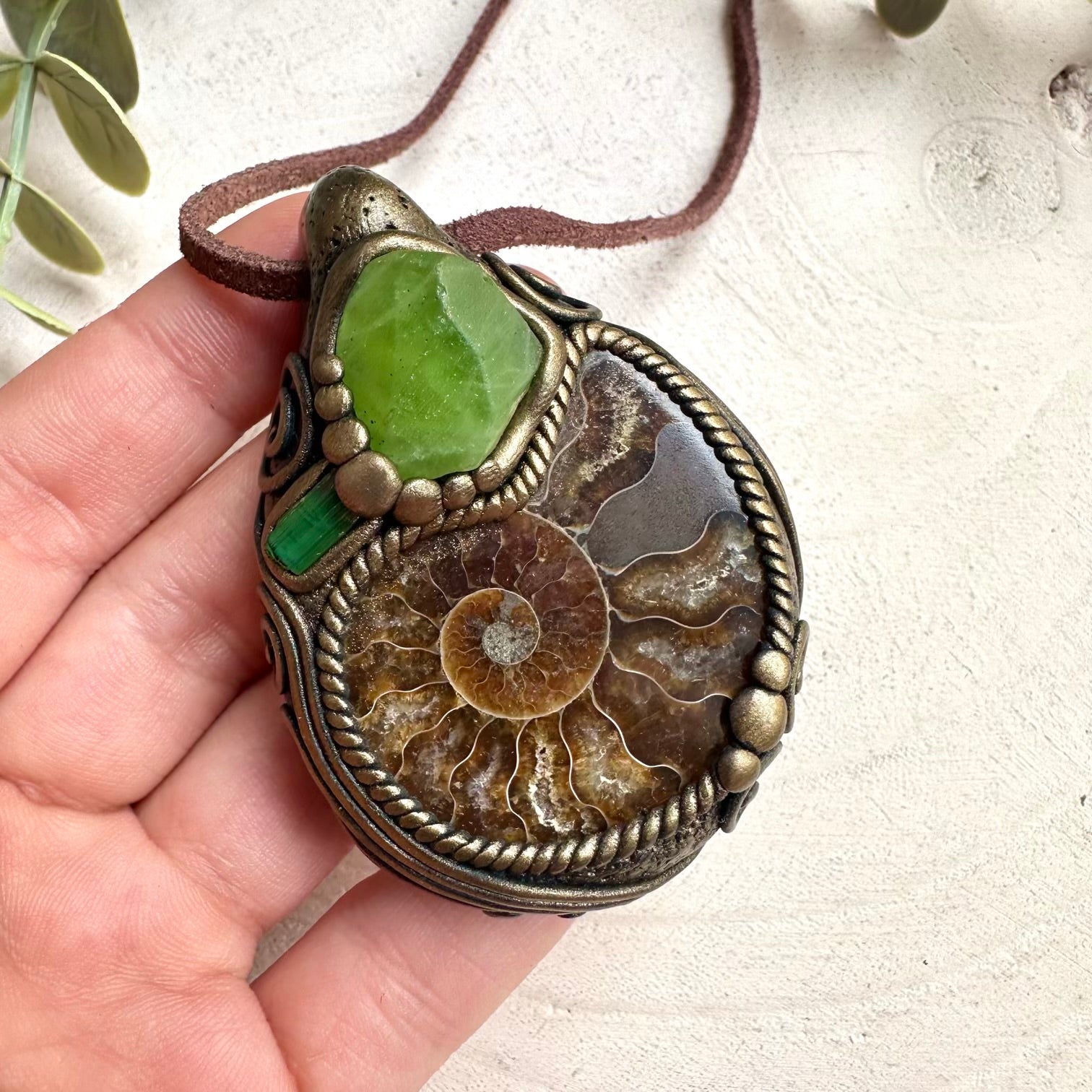 Fantasy healing crystal jewelry necklace featuring ammonite fossil and natural peridot gemstones