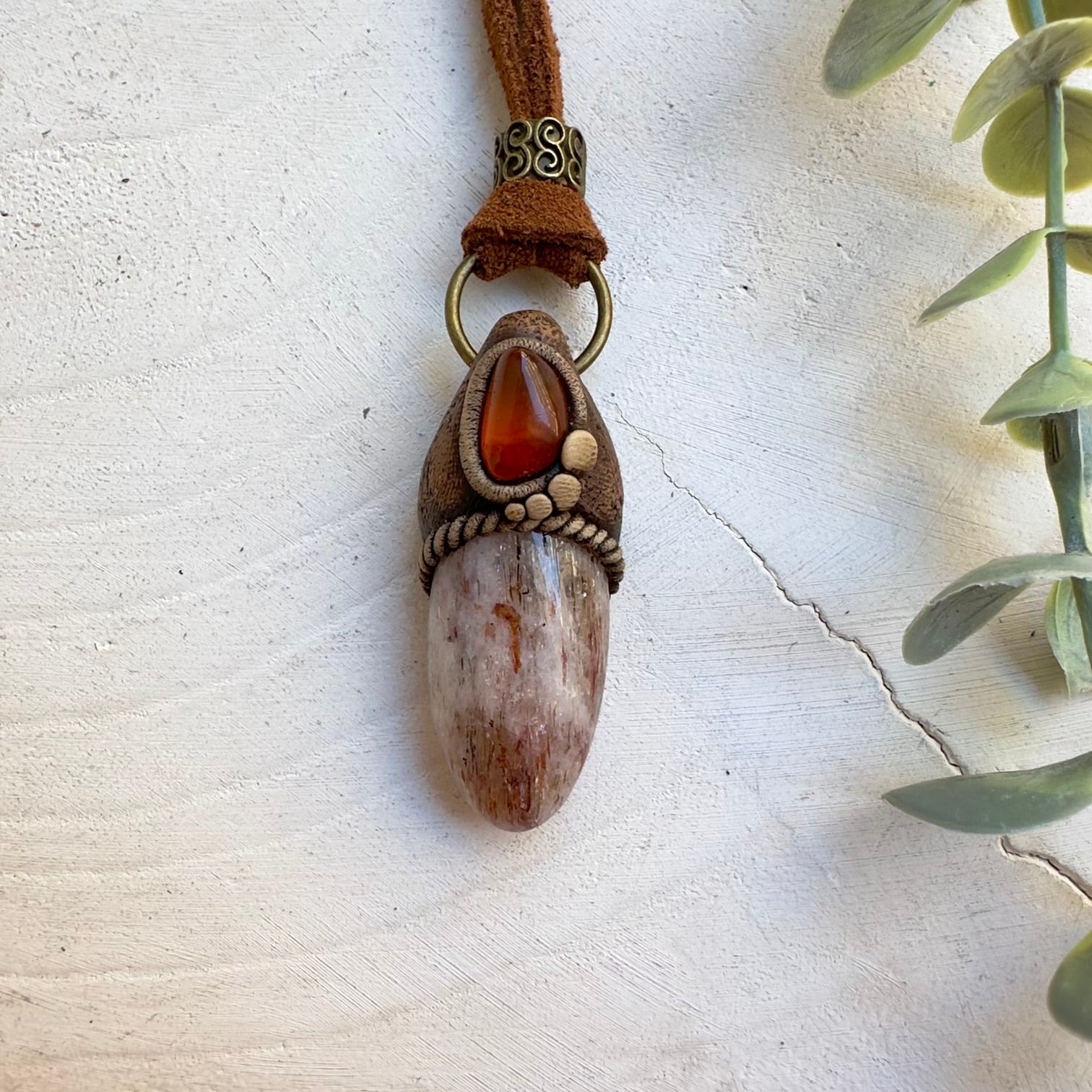 Handmade spiritual jewelry with Amber and Hematite Quartz