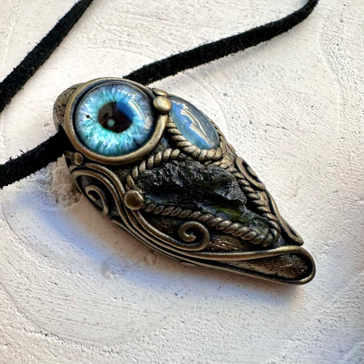 Unisex spiritual protection talisman necklace with natural raw-look Moldavite and Aquamarine eye amulet.