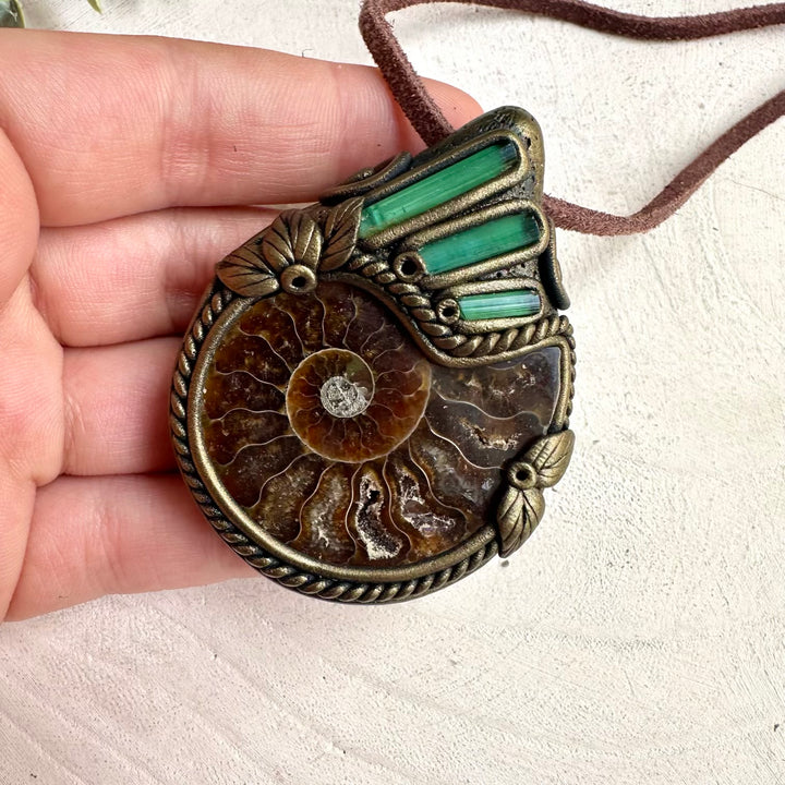 Forest inspired crystal necklace with green tourmaline stones and ancient ammonite fossil