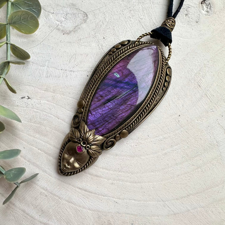 Large purple labradorite paired with ruby in a necklace